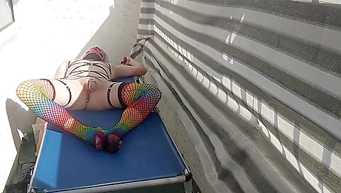 Caged Sissy Plays With Her Dildo On Public Balcony