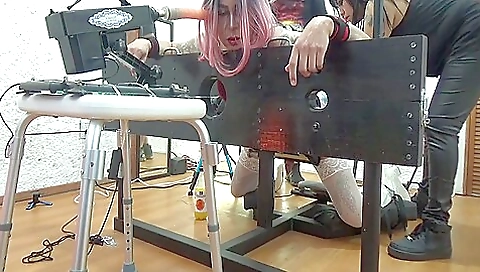 I'm getting a dildo in my ass and in my mouth in a hardcore bdsm vid