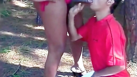 Beautiful ebony brunette deepthroating a dude in a video